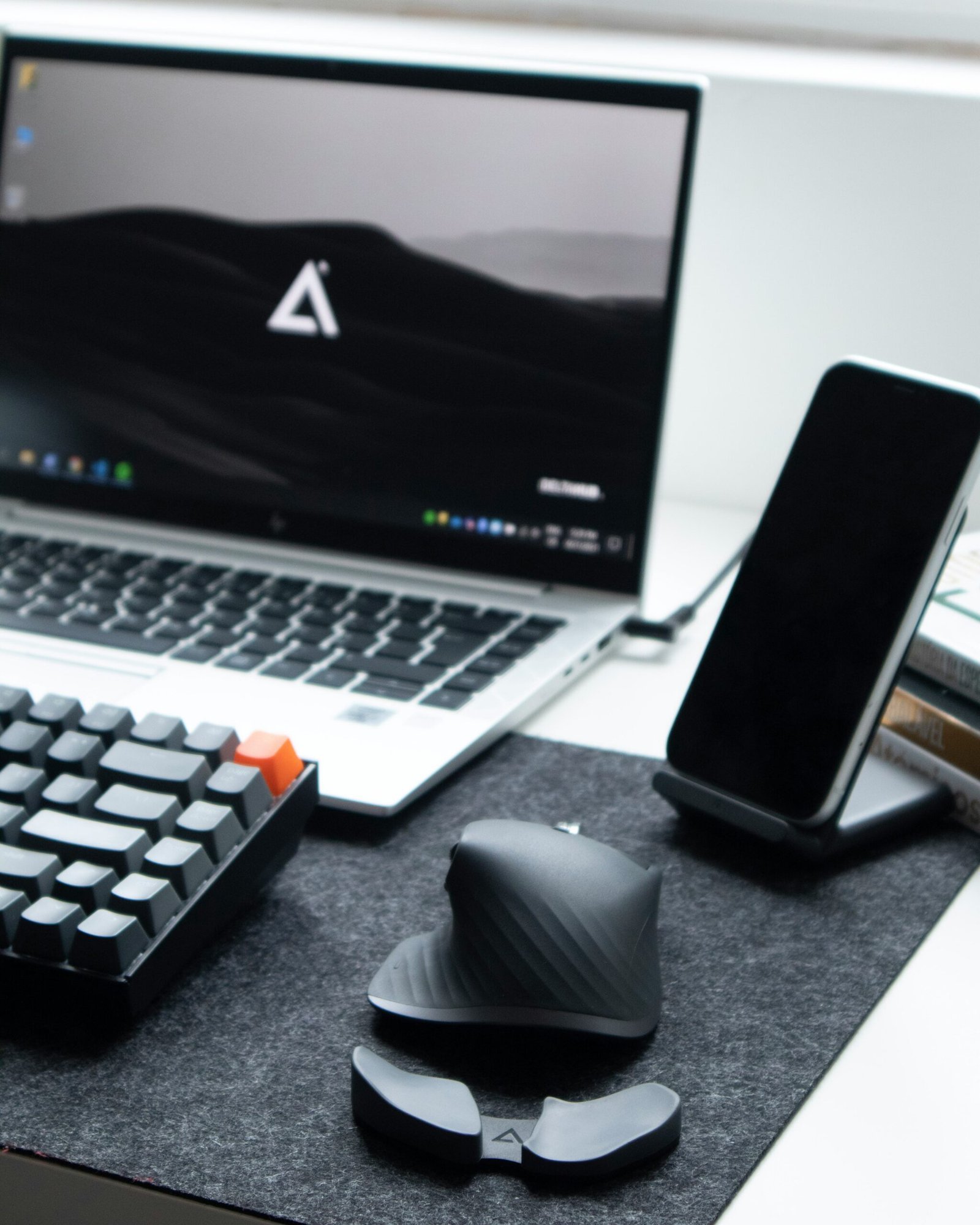 black and white computer keyboard beside black ipad